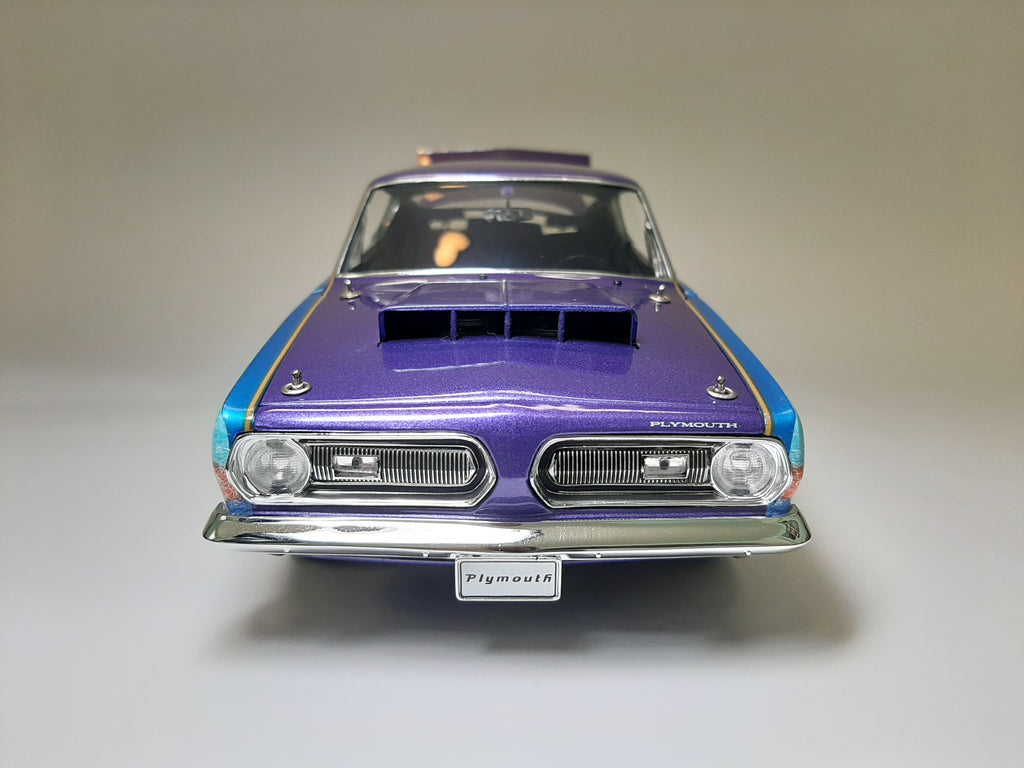A 1/18 scale diecast model of a 1968 Plymouth Barracuda.
