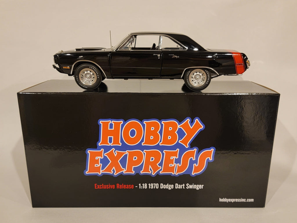 A 1/18 scale diecast model of a 1970 Dodge Dart Swinger 340 with a red tail stripe, displayed on top of its black box packaging labeled 'Hobby Express Exclusive'.
