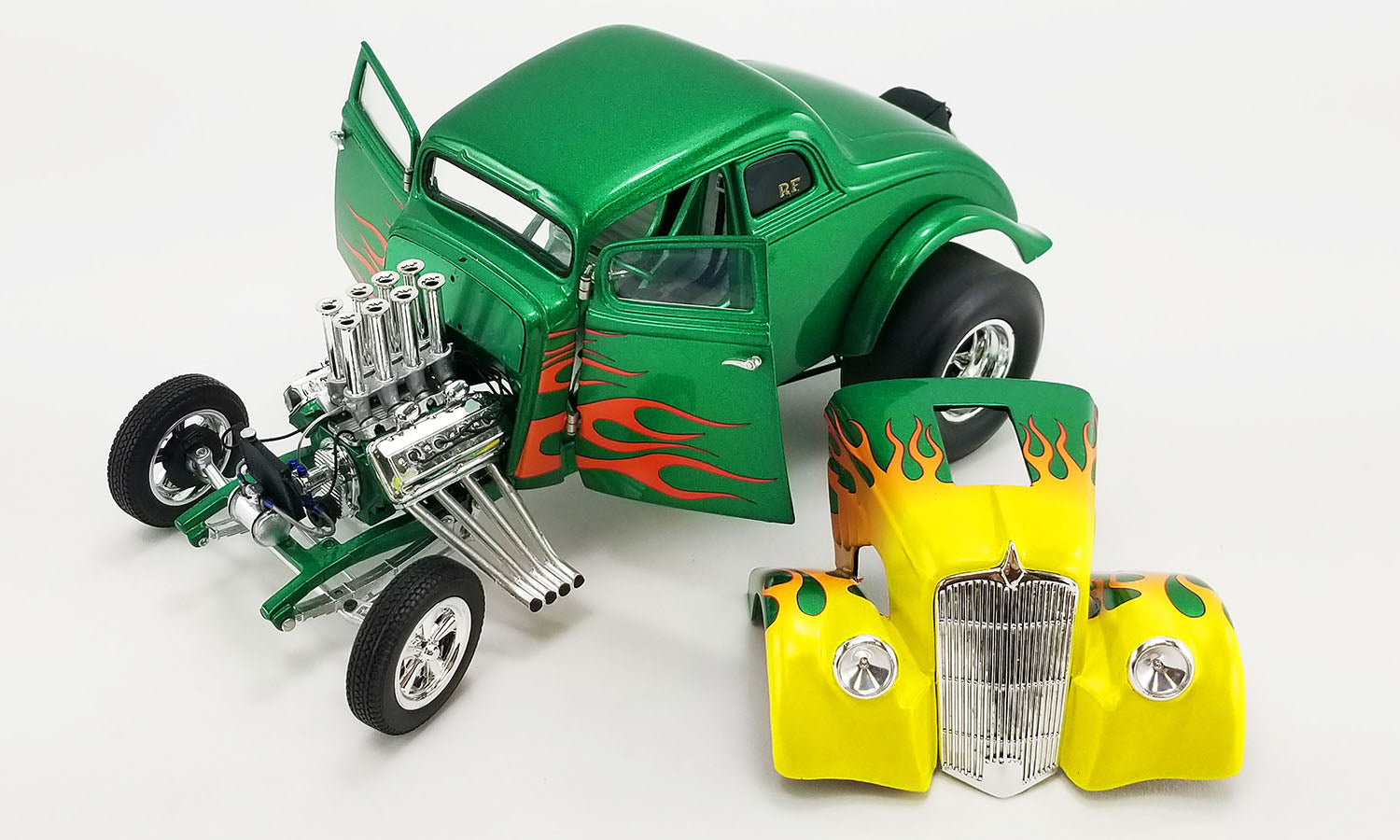 Diecast model car of 1933 Gasser painted green with flames with doors open and front removed reveal Gasser engine.
