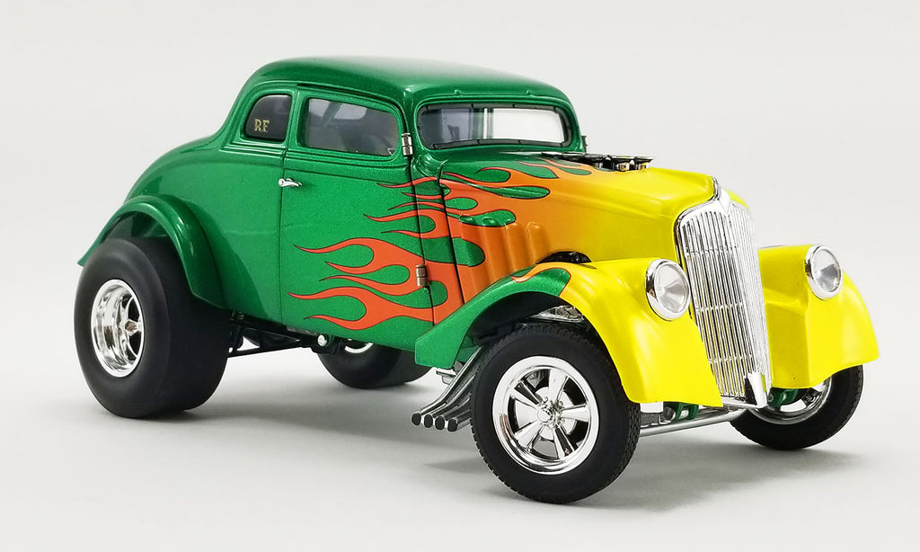 Diecast model car of 1933 Gasser painted green with yellow to orange flames.