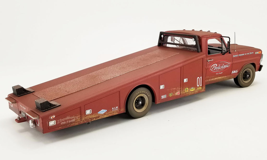 A 1/18 scale model of a 1970 Ford F-350 Ramp Truck with "Porkchop's" branding on the door.