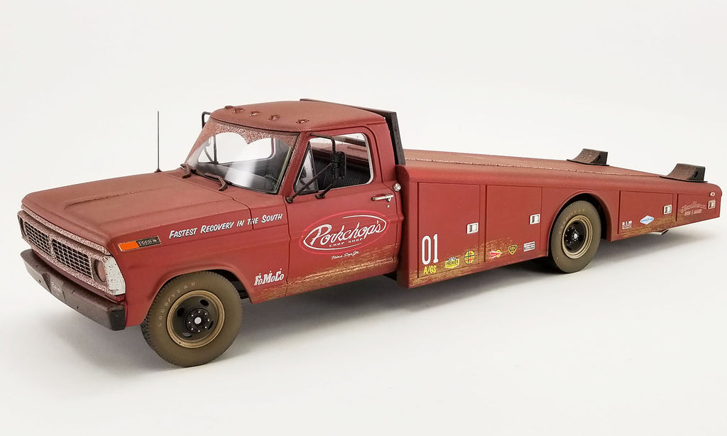 A 1/18 scale model of a 1970 Ford F-350 Ramp Truck with "Porkchop's" branding on the door.