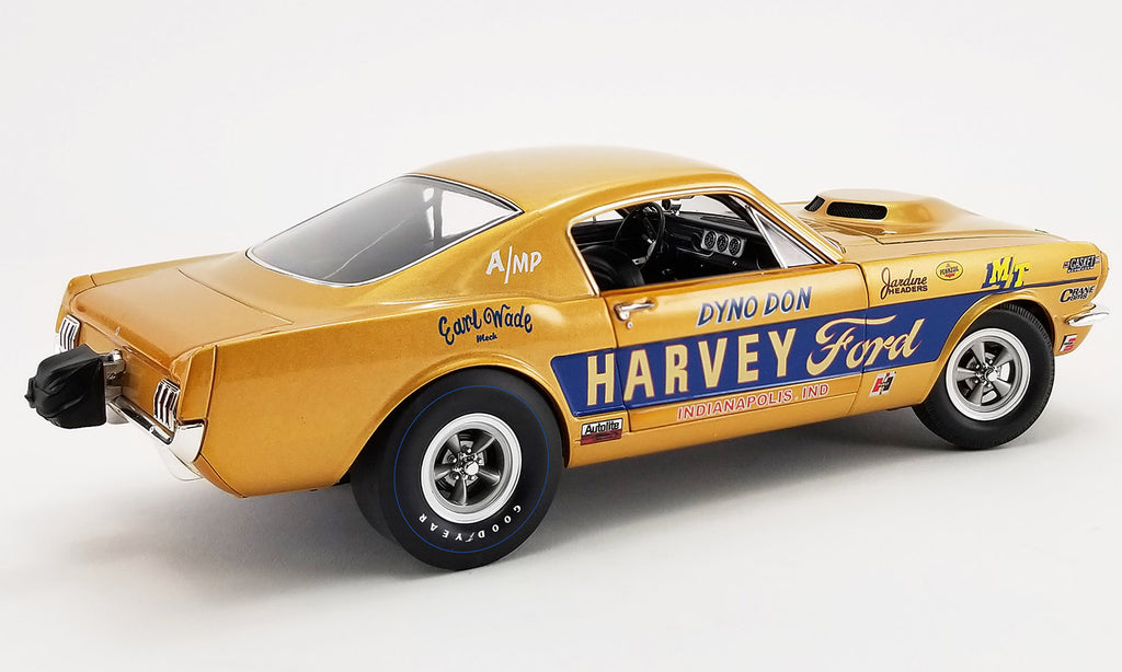 A 1/18 scale model of a yellow 1965 Ford Mustang A/FX 'Harvey Ford' with detailed chassis, real rubber tires, and opening doors.