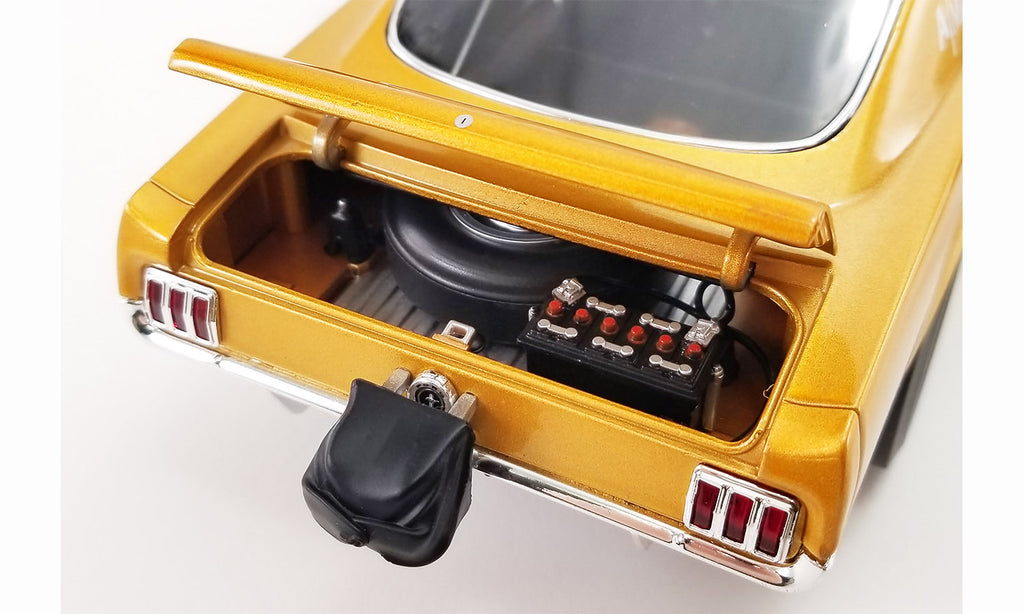 Open trunk of A 1/18 scale model of a yellow 1965 Ford Mustang A/FX 'Harvey Ford'