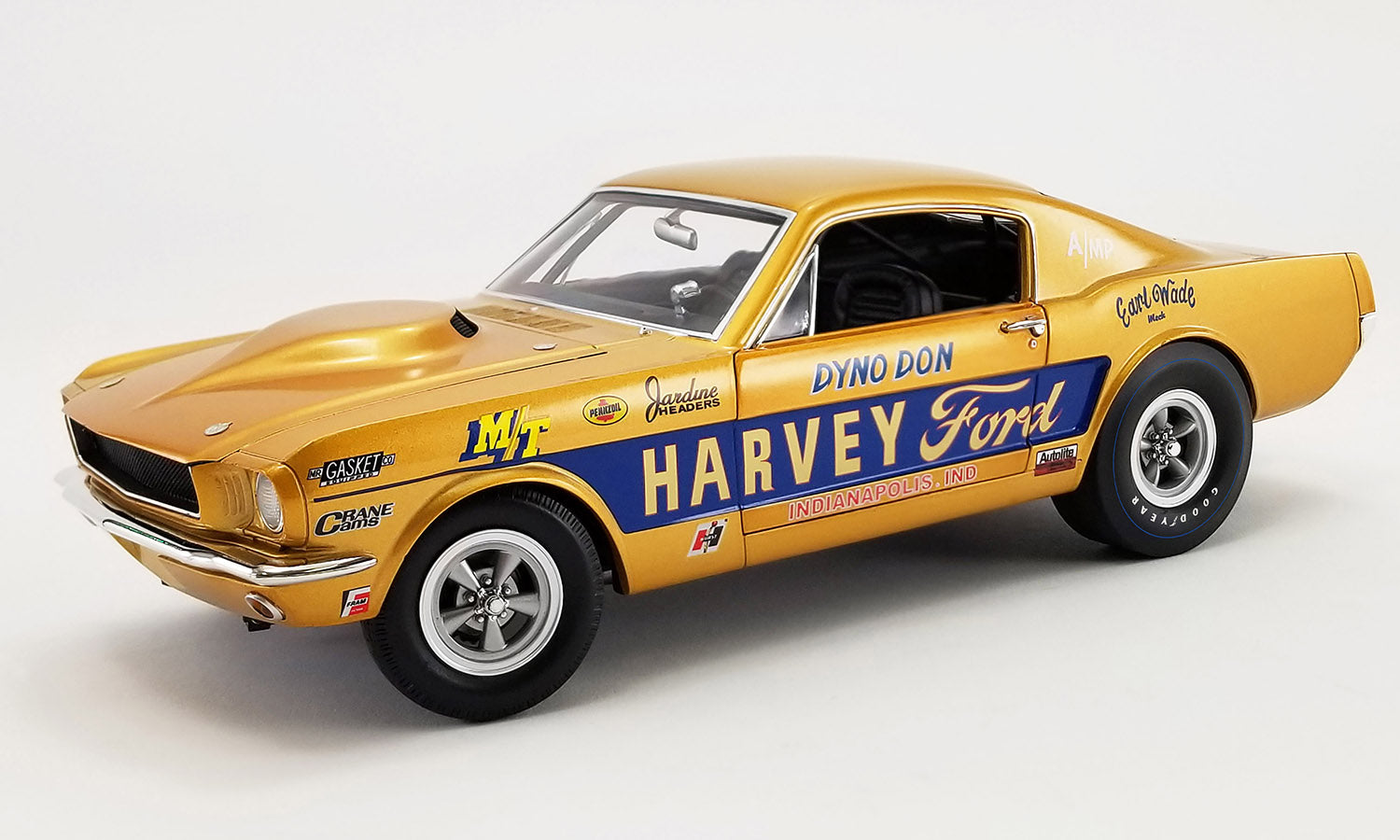 A 1/18 scale model of a yellow 1965 Ford Mustang A/FX 'Harvey Ford' with detailed chassis, real rubber tires, and opening doors.