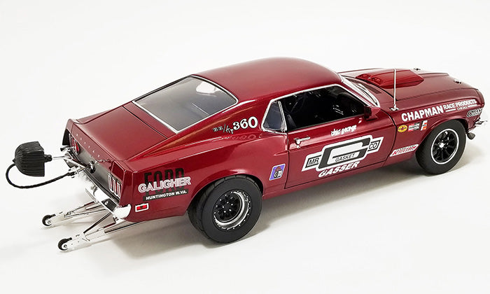 1/18 scale model of a red 1969 Ford Mustang Boss 429 with race graphics on the side.