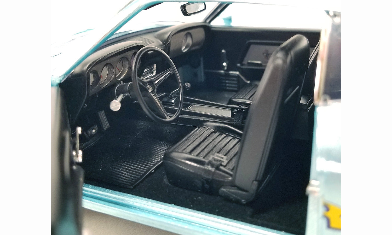 Interior of a diecast model of a 1969 Ford Mustang.