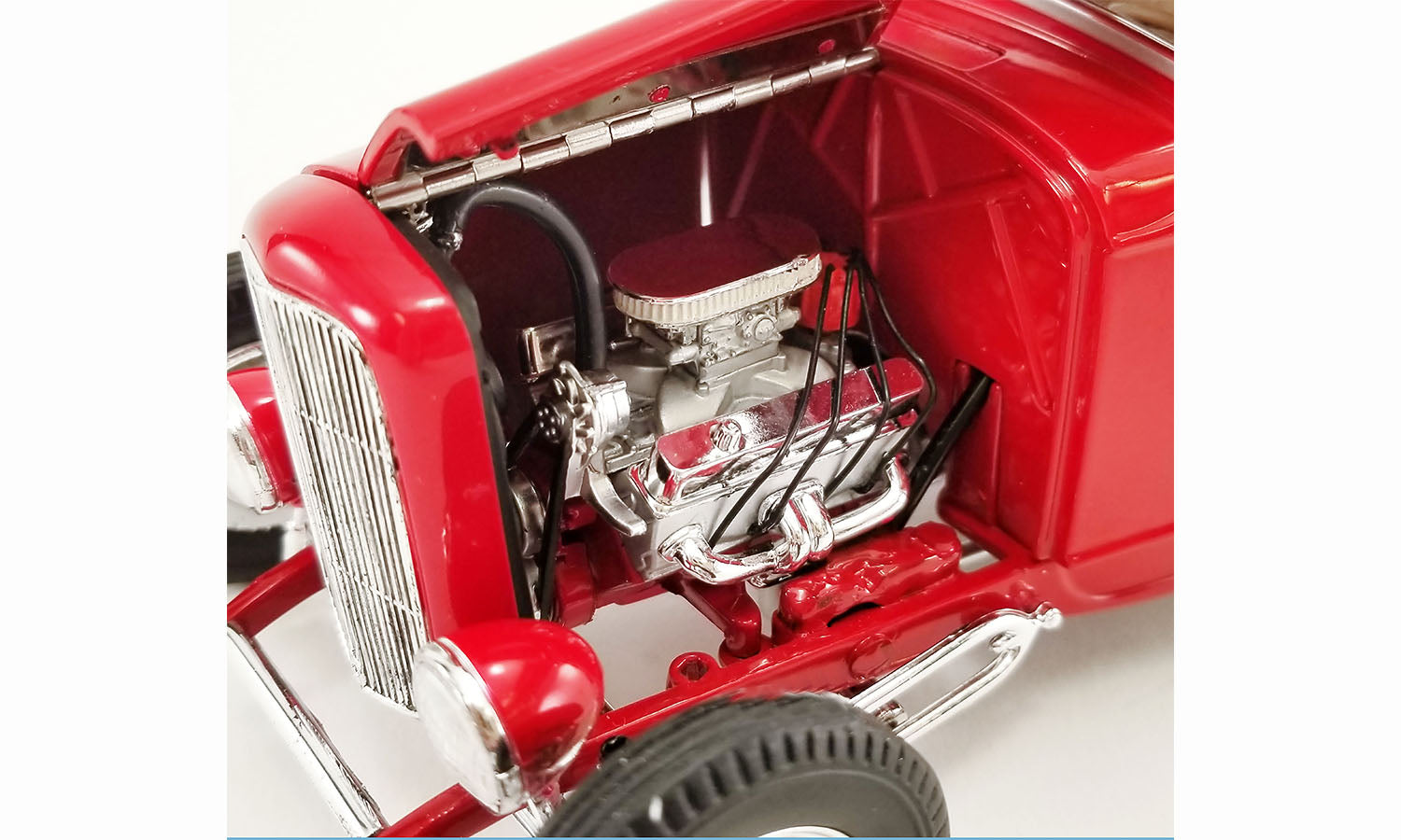 Close up of the engine in a diecast model car.