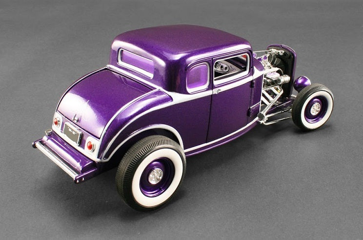 A 1/18 scale model of a 1932 Ford Five Window Coupe in purple color with a detailed interior and exterior, rubber tires, and open engine compartment.