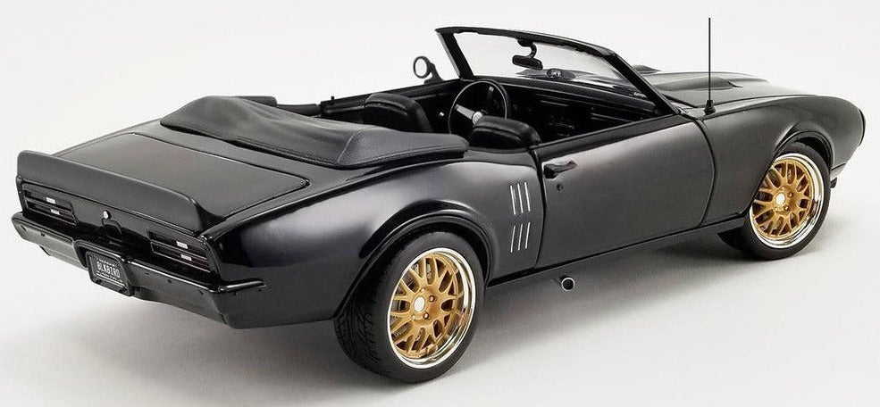 1/18 scale diecast model car of 1969 Pontiac Firebird in black with a open convertible roof.