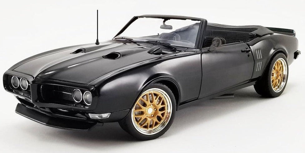 1/18 scale diecast model car of 1969 Pontiac Firebird in black with a open convertible roof.