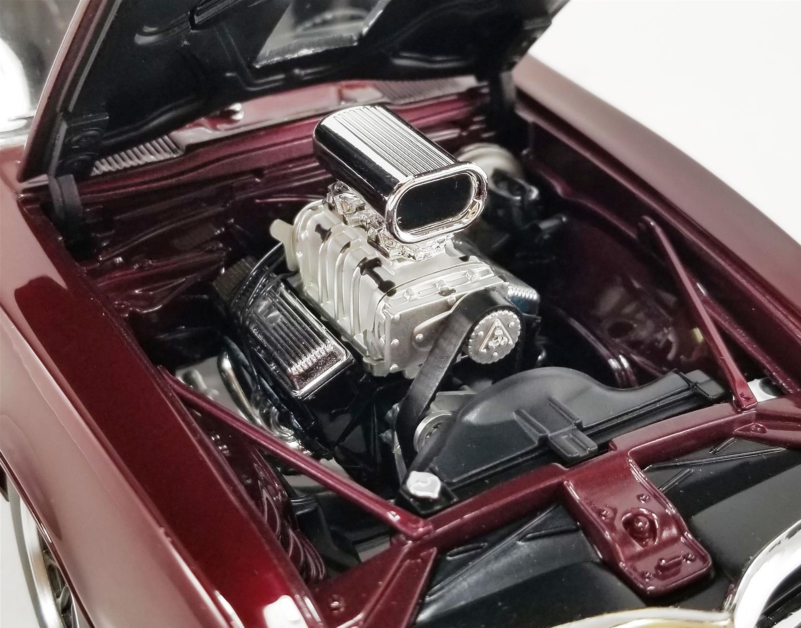 Close up of a blown 455 engine in a diecast model car.