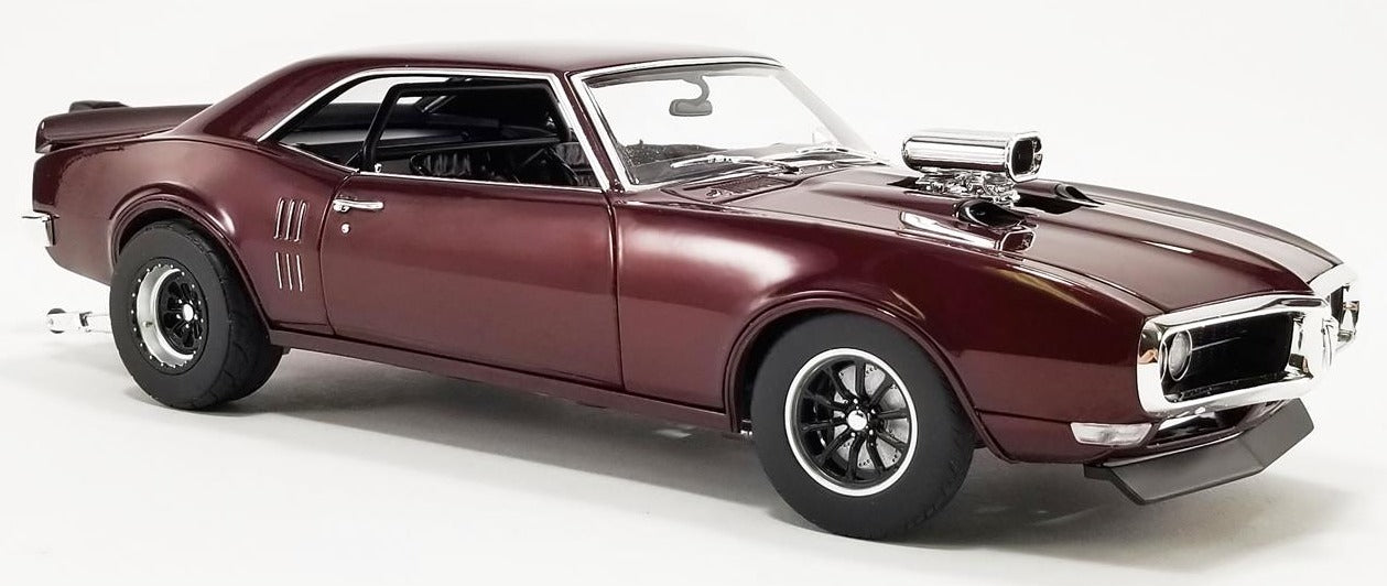 A 1/18 scale model of a 1968 Pontiac Firebird Drag Outlaws in metallic maroon color.