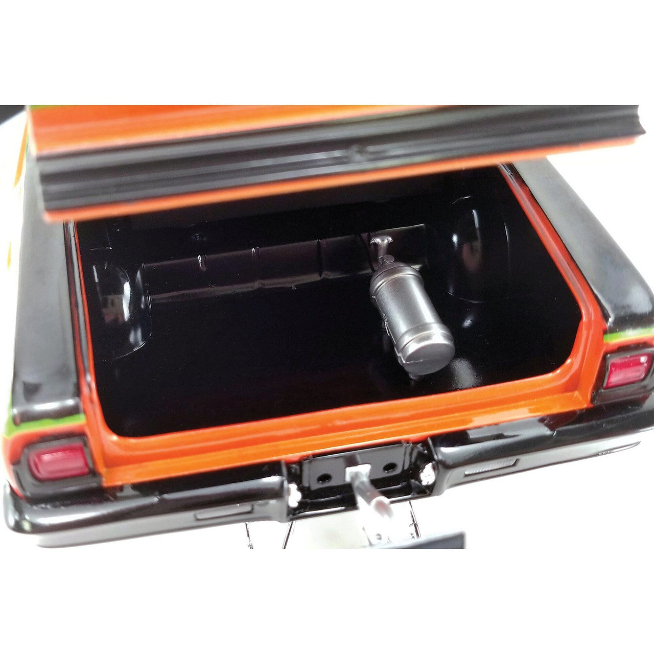 Close up of trunk on an orange diecast model car.