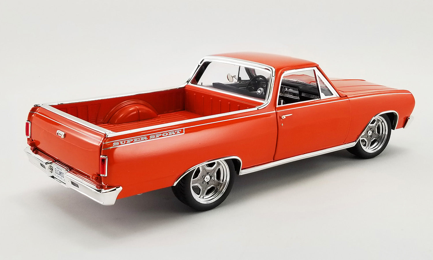 1/18 scale model of a 1965 Chevrolet El Camino Custom in orange.