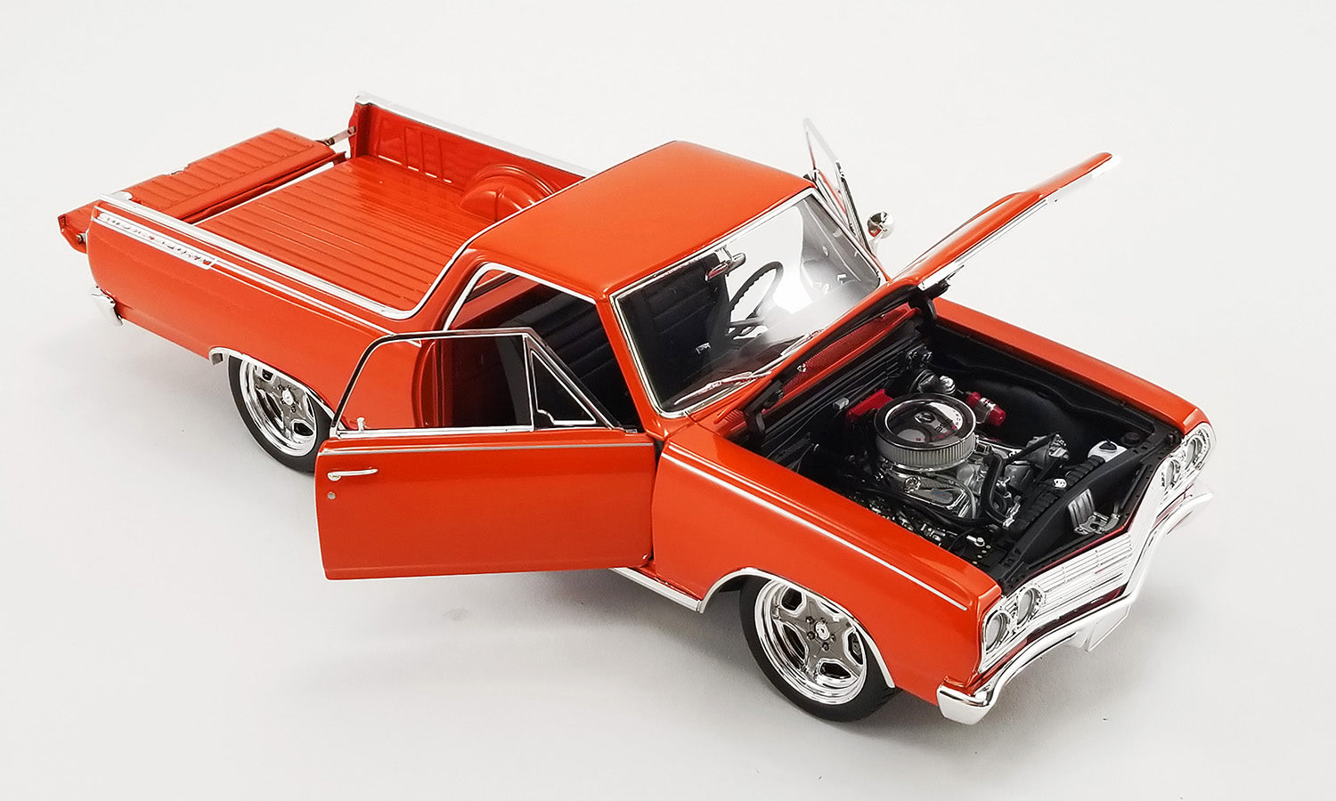 1/18 scale model of a 1965 Chevrolet El Camino Custom in orange showing the opening hood, doors, and tailgate.