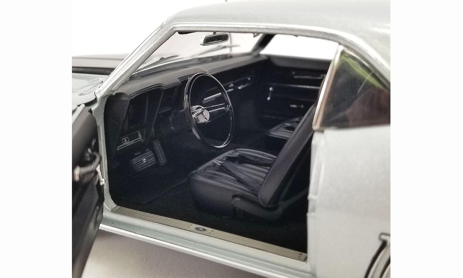 Close up interior of a diecast model car.