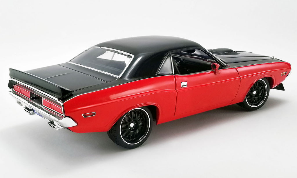 A 1/18 scale diecast model of a 1970 Dodge Challenger R/T Street Fighter in red and black colors.