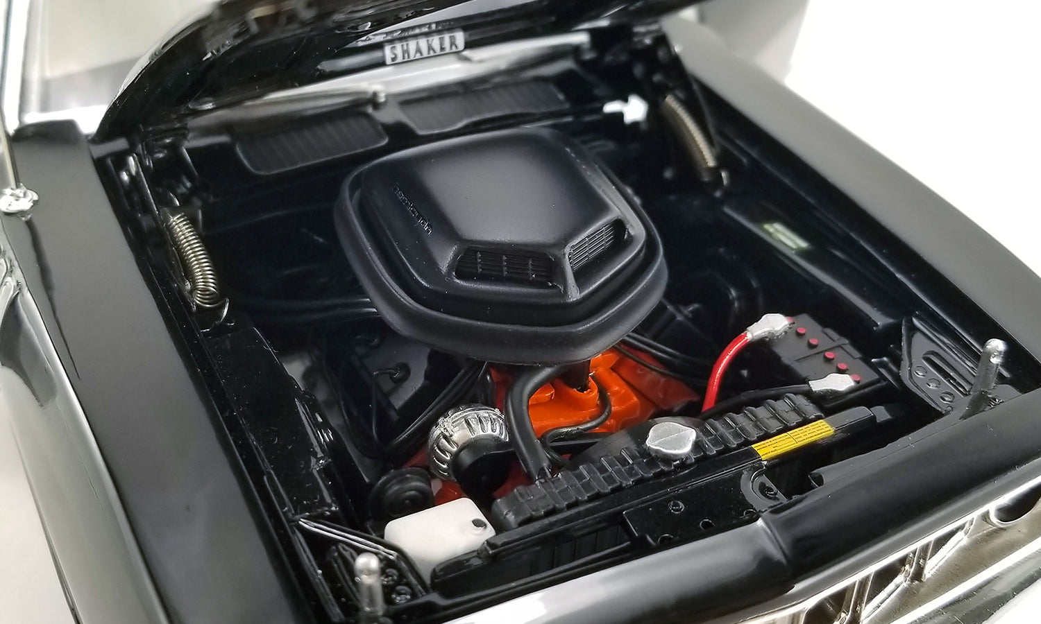 Under the hood engine view of 1/18 scale model car.