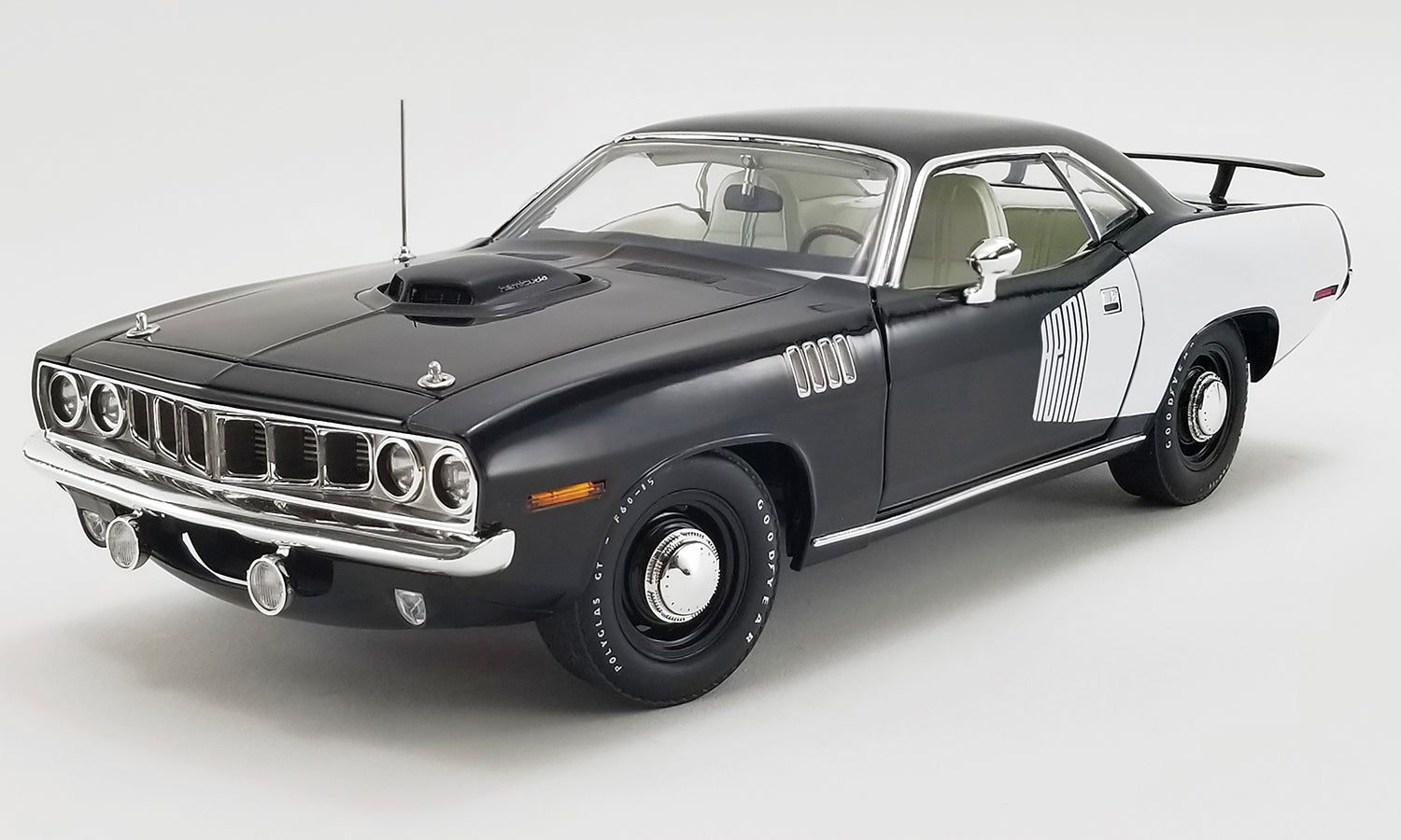 1/18 scale model car of 1971 Hemi Cuda in black with white.
