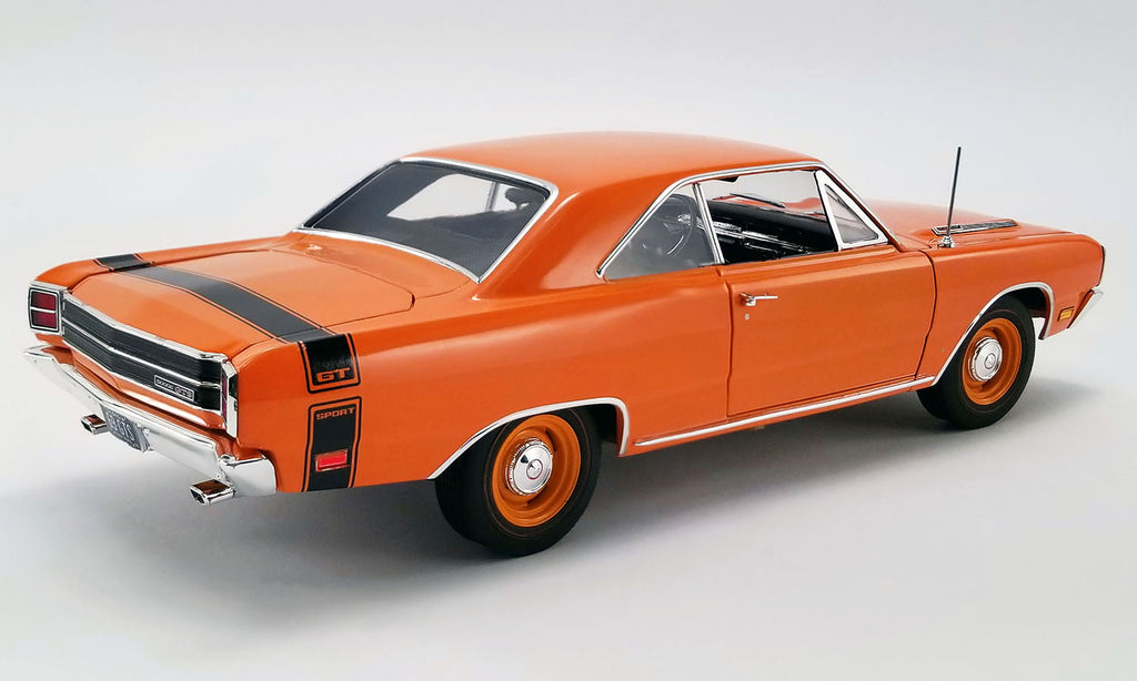A 1/18 scale model of a 1969 Dodge Dart GTS in orange with black stripe on the rear.