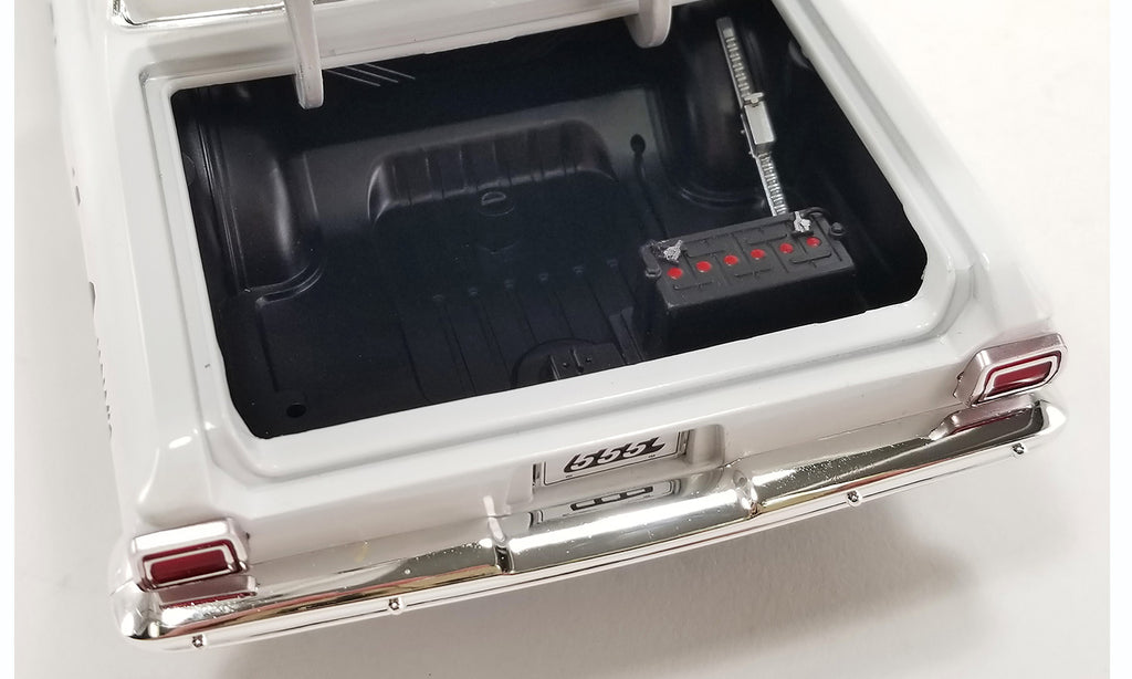 Open trunk of 1/18 scale model car.