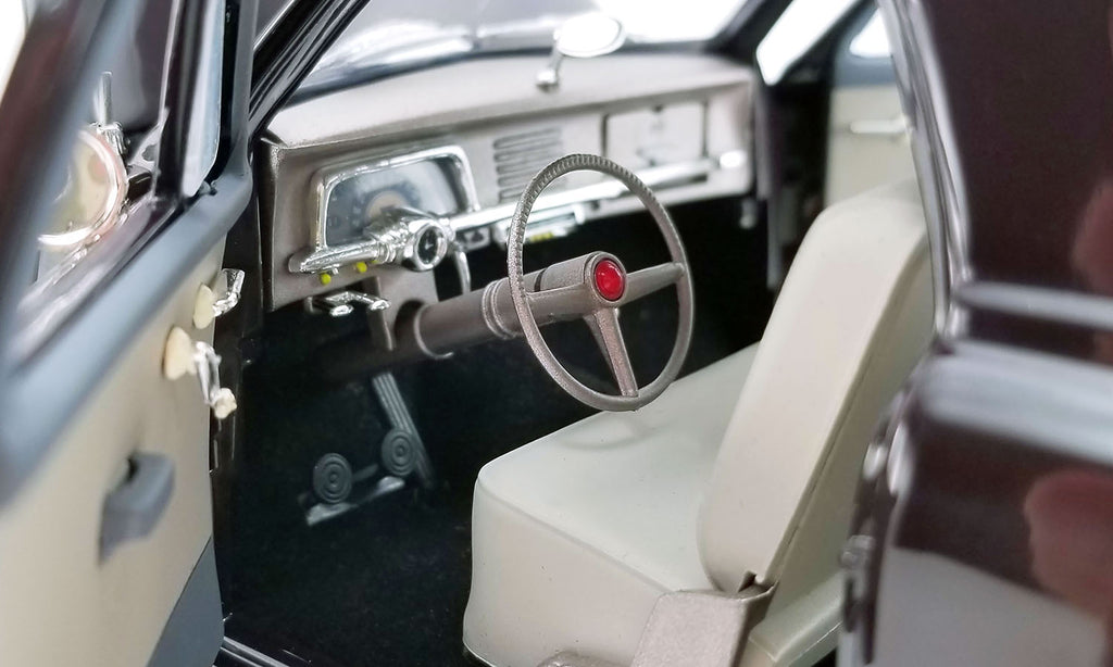 Close up of driver's side interior in a diecast model car.