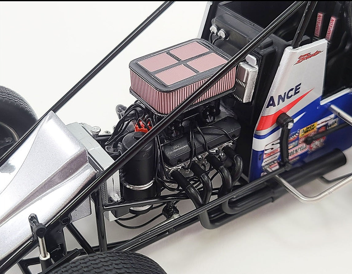 Close up of the engine on a diecast model of a sprint car.