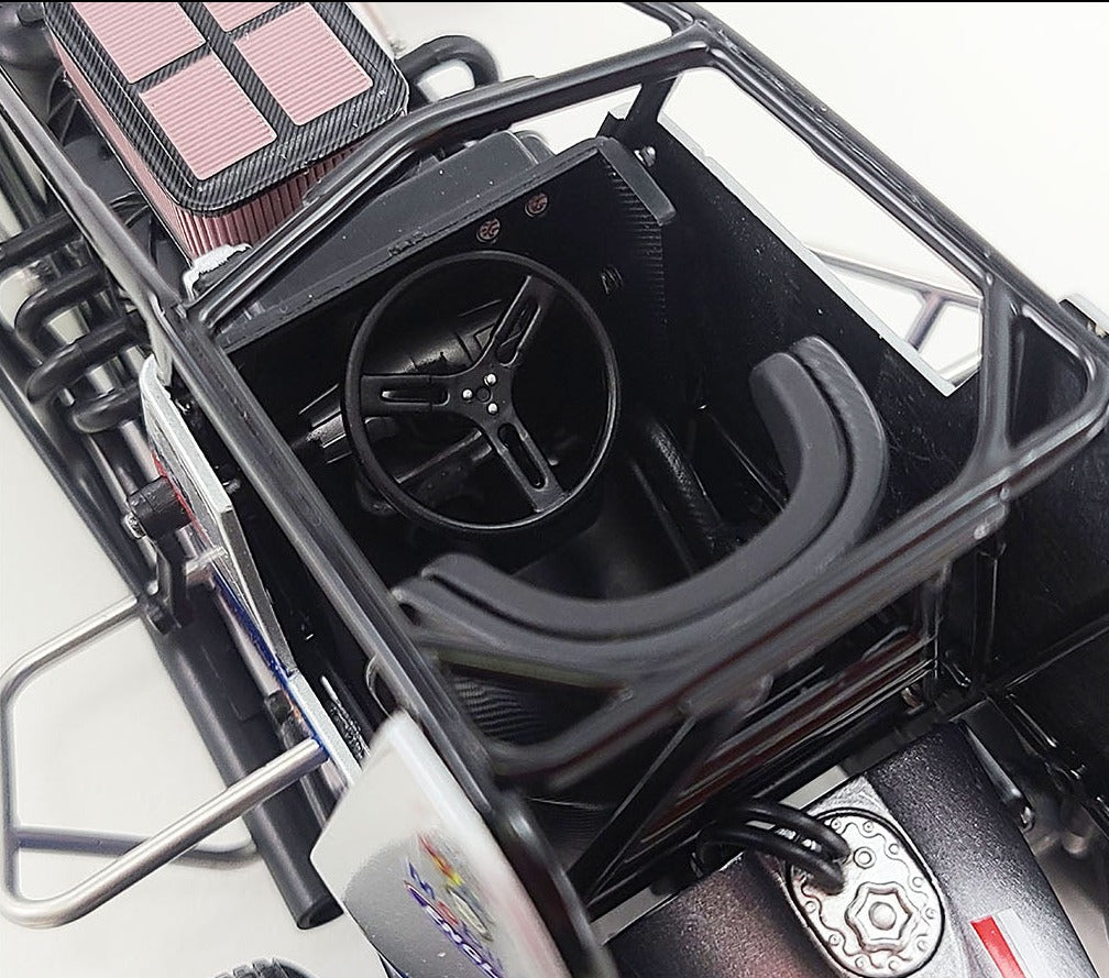 Close up of the drivers seat on a model of a sprint car.