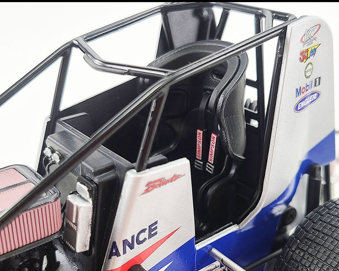 Close up of the drivers seat on a model of a sprint car.