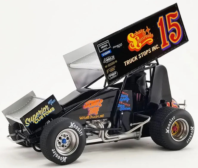 Diecast model sprint car with "Schatz Crossroads" and the number 15 on the side.