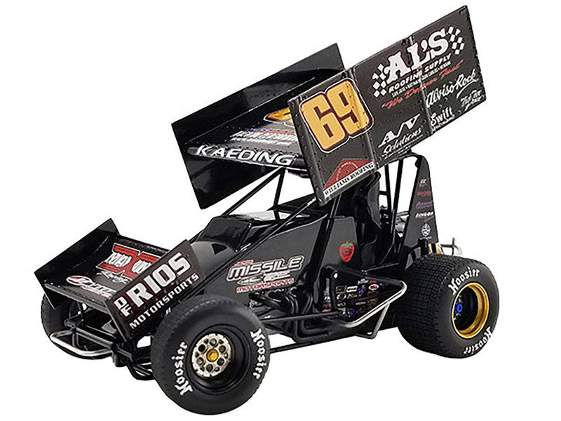 Diecast model sprint car with advertising graphics on the sides.