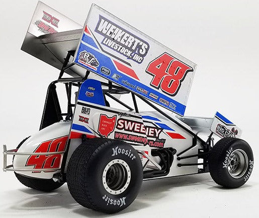 Diecast model sprint car with advertising graphics on the sides.