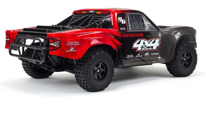 Rear and side view of black and red short course truck.