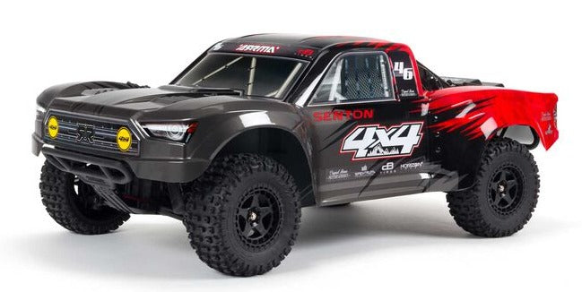 Front and side view of black with red short course truck.