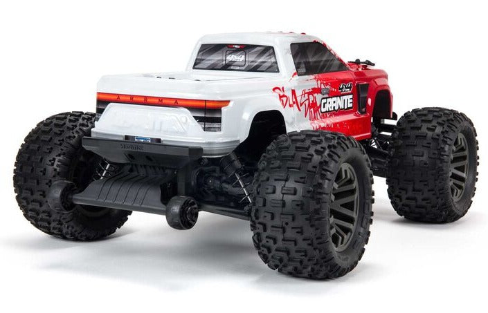 Rear view of red and white monster truck.