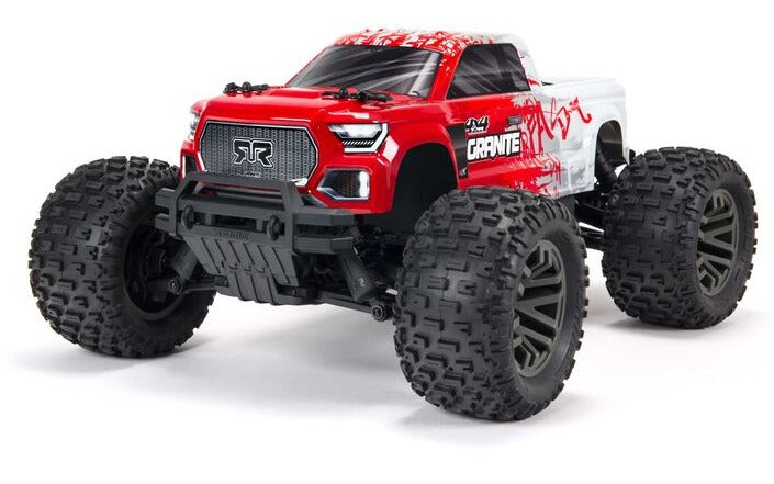 Front view of red and white monster truck.