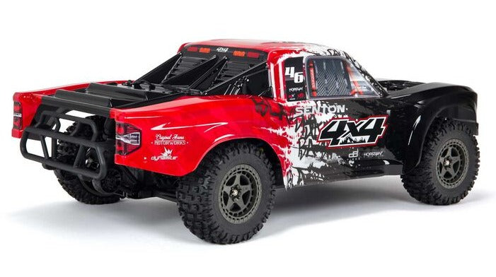 Rear view of black and red short course truck with lexan body.