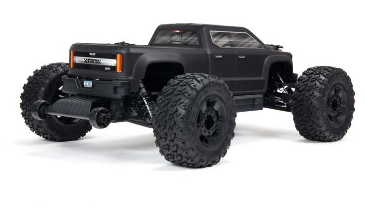 Rear view of black monster truck with lexan body.