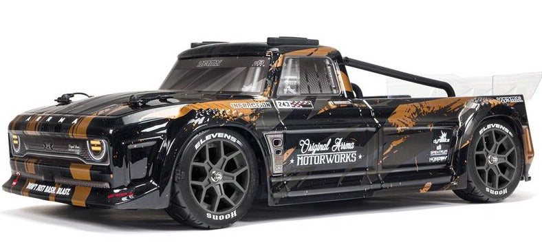 Front view of pick up truck with black and brown lexan body.