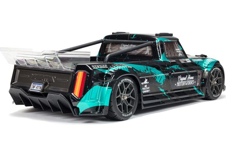 Rear and side view of teal and black truck