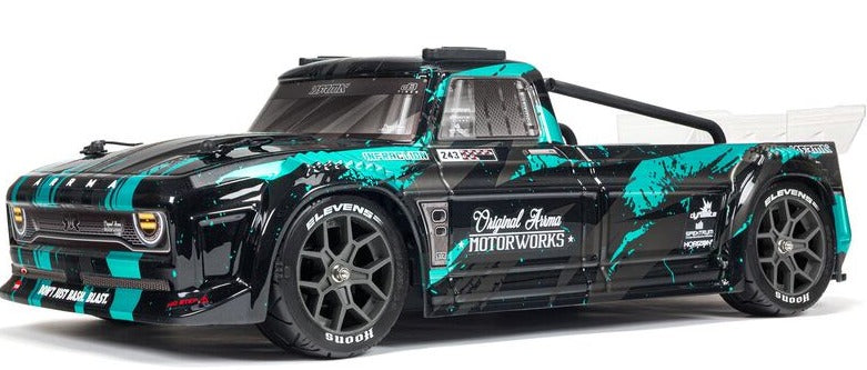 Front and side view of teal and black truck.