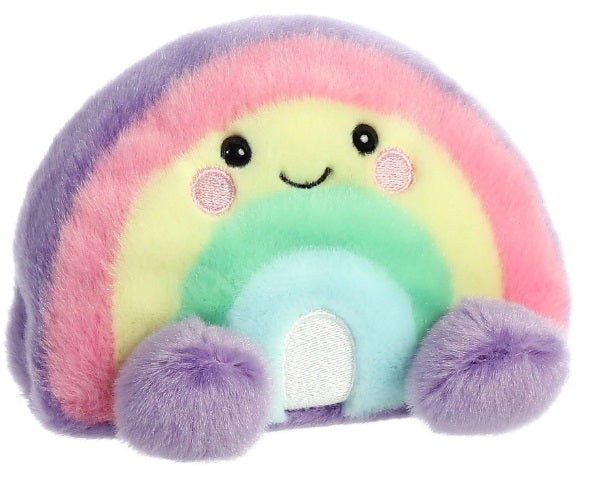 Rainbow shaped plush toy with an adorable stitched on smile and two purple feet.
