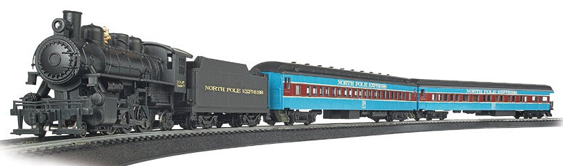 HO Scale model steam engine with 2 passenger cars.