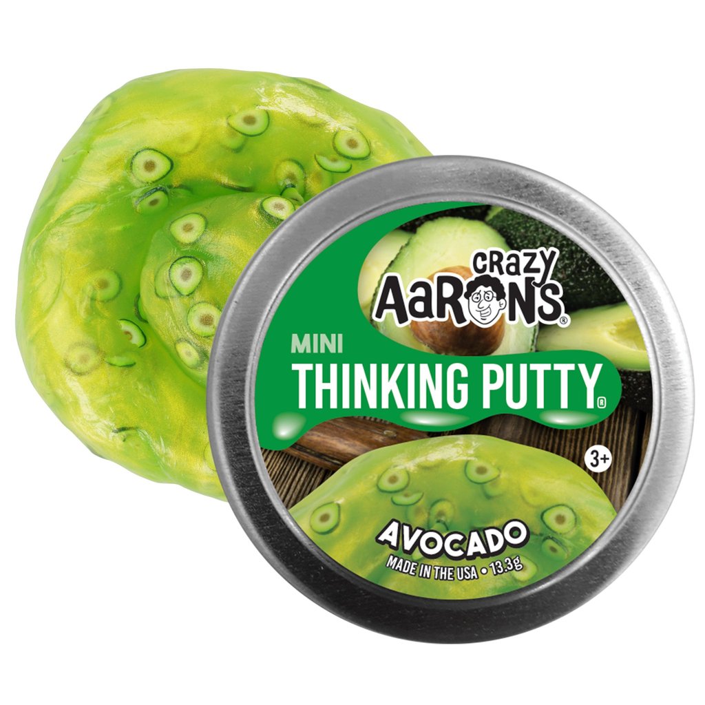 Round metal tin and swirl of green putty with small avocado shapes mixed in.