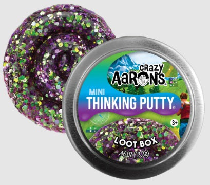 Round metal tin with swirl of purple, green, and gold putty.