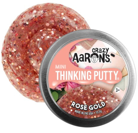 Round metal tin with swirl of pink putty with sparkles.