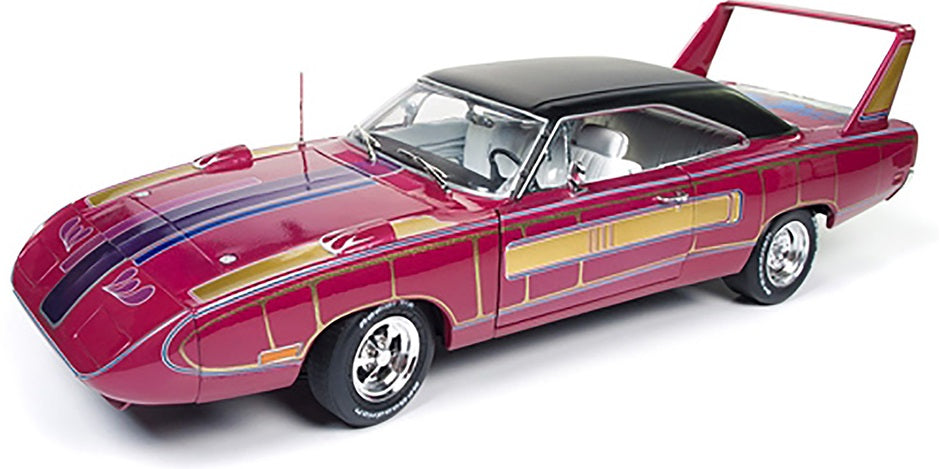 1/18 scale model of a 1970 Plymouth Superbird in pink with various other colors painted on and black roof and white interior.