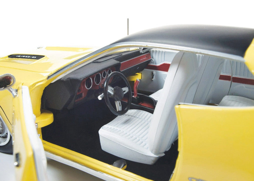 Close up of the interior on 1/18 scale model of a yellow 1971 Plymouth GTX Hardtop.