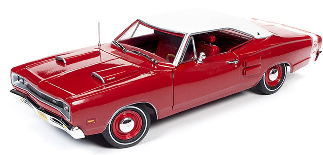 A 1/18 scale model of a red 1969 Dodge Coronet Super Bee Hardtop with red interior and white roof.